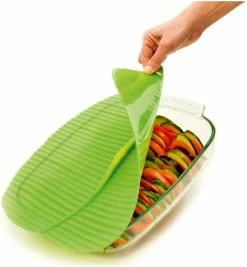 Charles Viancin Silicone Banana Leaf Baking Lid - Square, 10" X 10" 7 Charles Viancin Silicone Banana Leaf Baking Lid - Square, 10" X 10" -Cookware Sets Sales 2023 charles viancin banana leaf baking cover action shot compressed